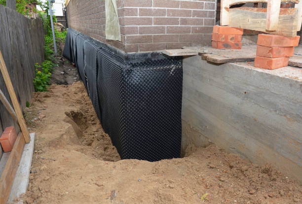 Happy homeowners after waterproofing job in Honeoye Falls